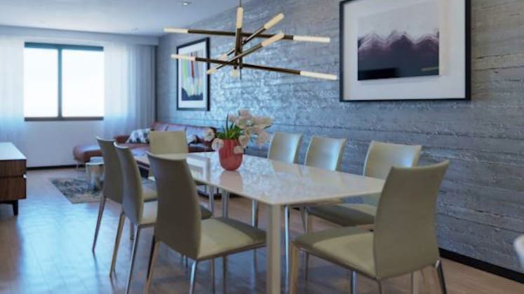 una sala de estar con gabinetes brillantes, mesa y lámpara, muebles