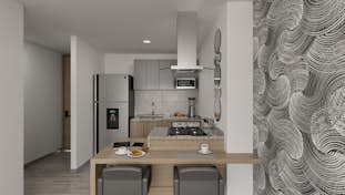 una cocina con buena ventilación natural, armarios brillantes, encimera