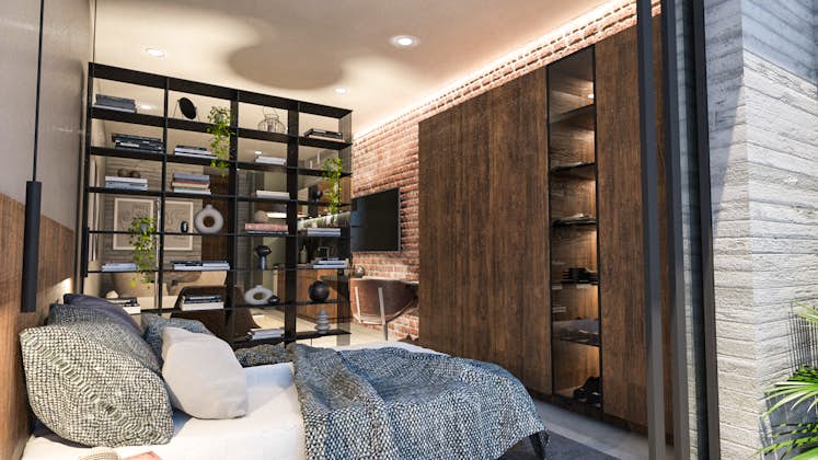 un dormitorio con espacio en el armario, buena ventilación natural, puerta de madera