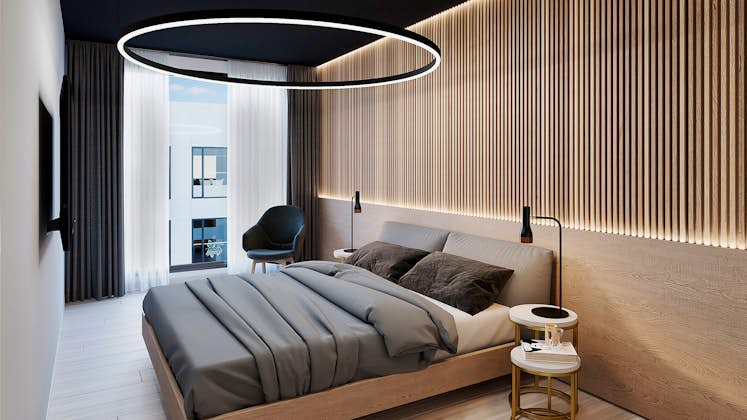 un amplio y lujoso dormitorio bien iluminado