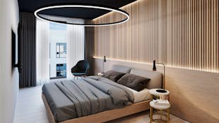 un amplio y lujoso dormitorio bien iluminado