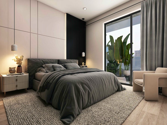 un lujoso y espacioso dormitorio con grandes ventanales